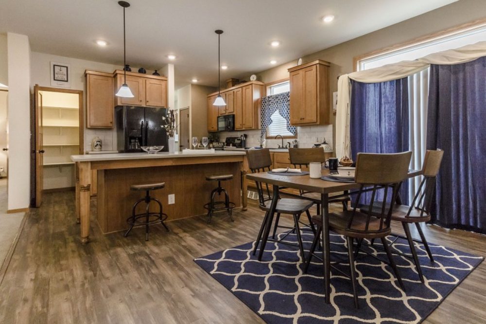 Modern kitchen with white cabinetry in a modular home