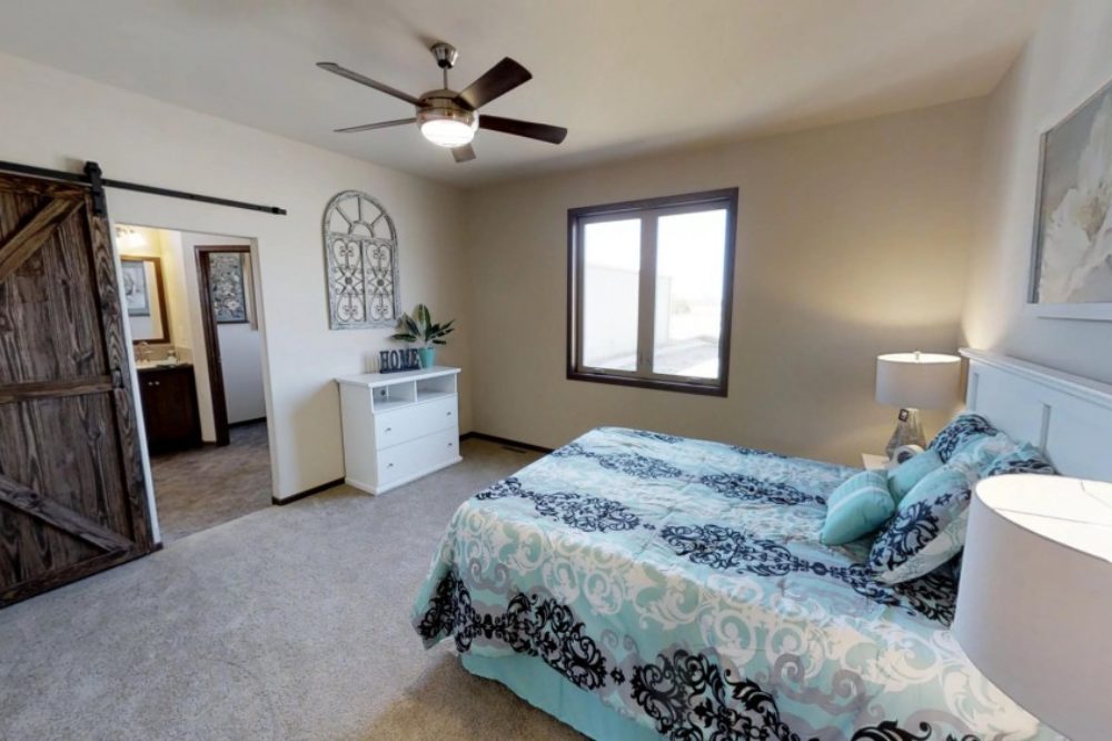Spacious master bedroom in a BonnaVilla modular home