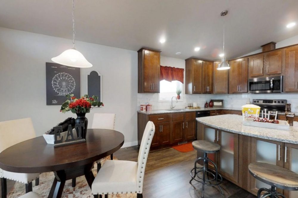 Open kitchen with island seating in a modular home